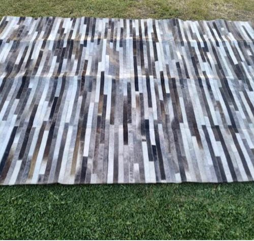 Large cowhide mat with non slip back 6 feet x 9 feet